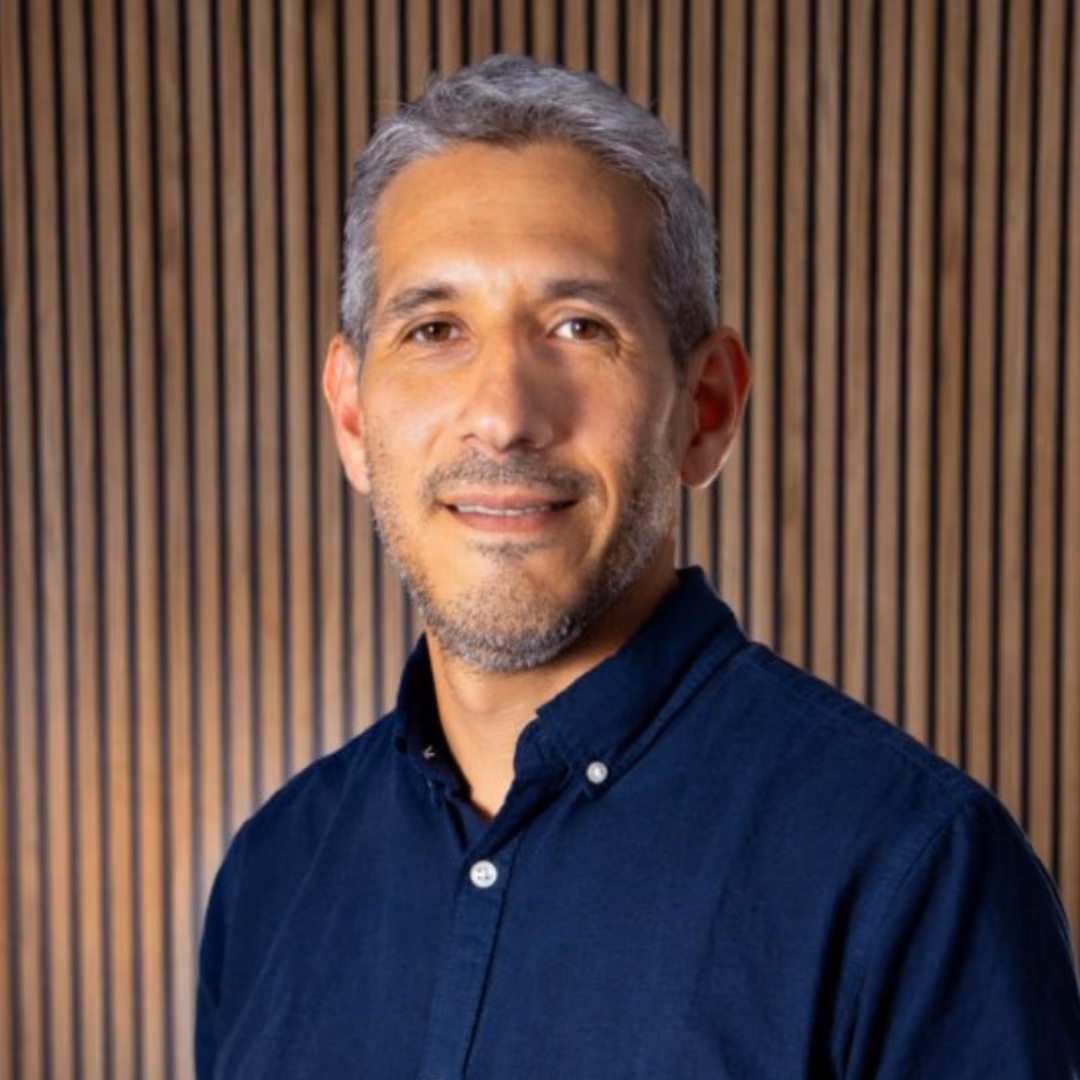 Portrait of Carlos Vega in a navy blue shirt